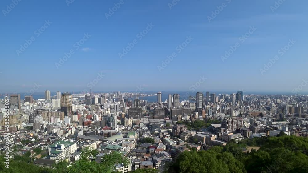KOBE, HYOGO, JAPAN - JUNE 2024 : Aerial high angle view of Kobe city and Kobe port in daytime. View of buildings and street around Kobe port tower and Sannomiya station. 4K time lapse shot. KOBE, HYOGO, JAPAN - JUNE 2024 : Aerial high angle view of Kobe city and Kobe port in daytime. View of buildings and street around Kobe port tower and Sannomiya station. 4K time lapse shot.