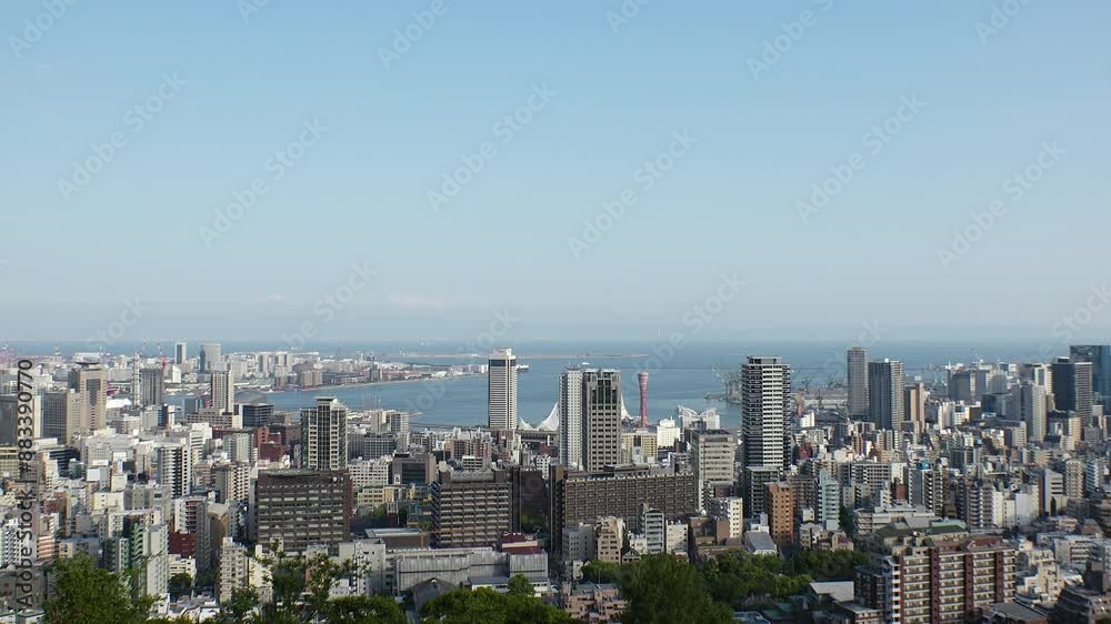 KOBE, HYOGO, JAPAN - JUNE 2024 : Aerial high angle view of Kobe city and Kobe port in daytime. View of buildings and street around Kobe port tower and Sannomiya station. 4K time lapse shot. KOBE, HYOGO, JAPAN - JUNE 2024 : Aerial high angle view of Kobe city and Kobe port in daytime. View of buildings and street around Kobe port tower and Sannomiya station. 4K time lapse shot.