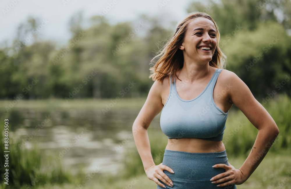 Woman smiling and exercising outdoors in a park, dressed in sportswear on a sunny day, enjoying fitness Woman smiling and exercising outdoors in a park, dressed in sportswear on a sunny day, enjoying fitness