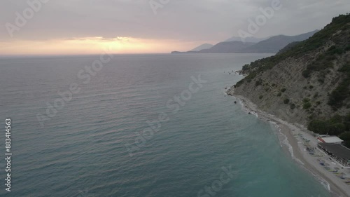  Aerial view of Sunset by Bunec Beach area in Summer 2022, Albania - raw data photo