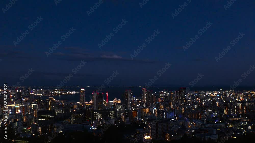 KOBE, HYOGO, JAPAN -JUN 2024 : Aerial high angle view of Kobe city and Kobe port in sunset. View of buildings and street around Kobe port tower and Sannomiya station. 4K time lapse shot, dusk to night KOBE, HYOGO, JAPAN -JUN 2024 : Aerial high angle view of Kobe city and Kobe port in sunset. View of buildings and street around Kobe port tower and Sannomiya station. 4K time lapse shot, dusk to night