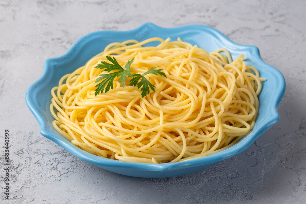 Buttered spaghetti pasta served looks delicious - Plain spaghett on dish - cooked spaghetti