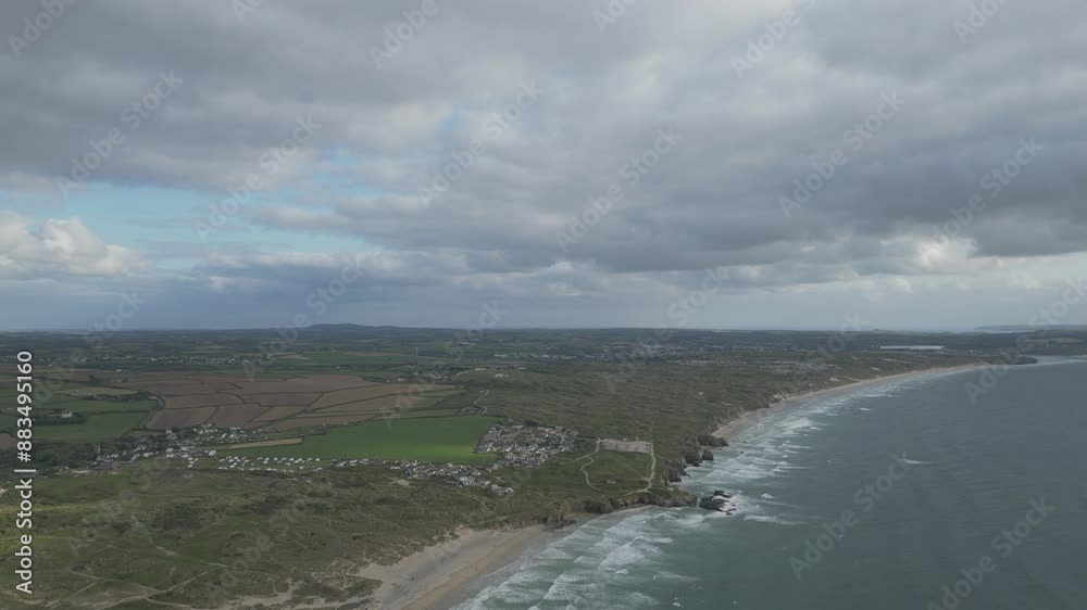Bird’s eye view of the coastline with villages in England, Cornwall. Bird’s eye view of the coastline with villages in England, Cornwall.