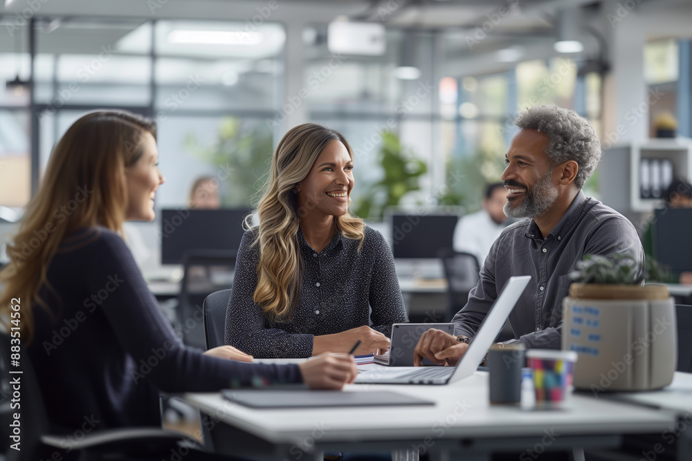 Smiling Coworkers Engage in Lively Conversation During a Break in a Modern Office Smiling Coworkers Engage in Lively Conversation During a Break in a Modern Office