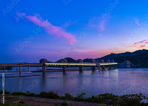 Summer and sunset view of Ipo Barrage on Namhan River with illumination against glow in the ski at Cheonseo-ri near Yeoju-si, South Korea
 photo