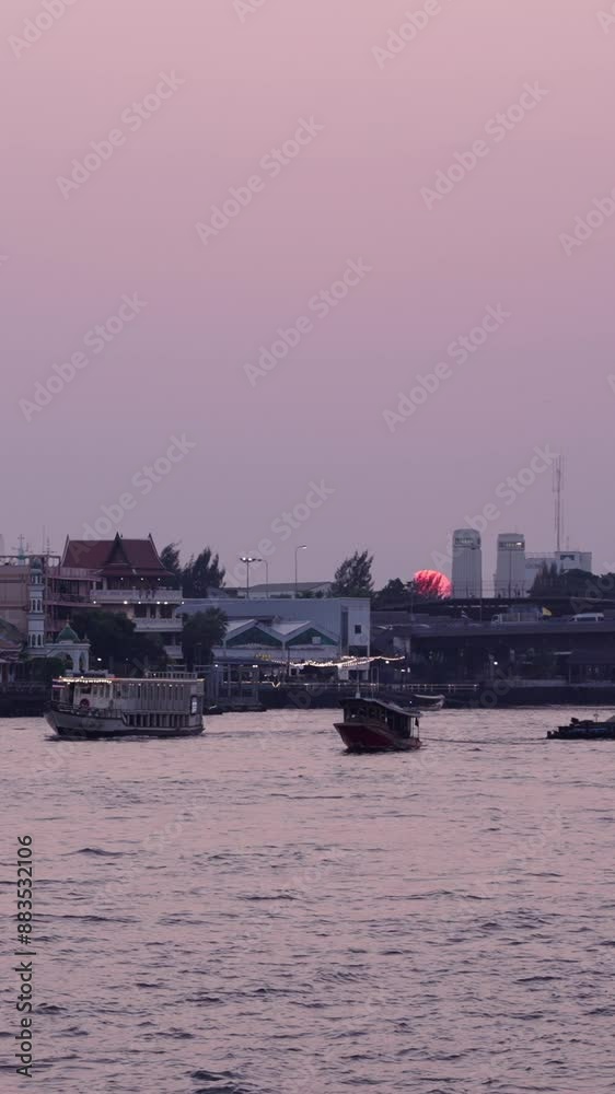 dusk from the chao phraya river where the illuminated boats circulate near the bridge with a lot of traffic in bangkok thailand dusk from the chao phraya river where the illuminated boats circulate near the bridge with a lot of traffic in bangkok thailand