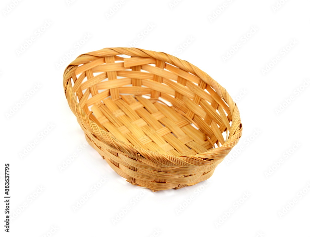 Obraz premium Empty wicker basket on a white background.