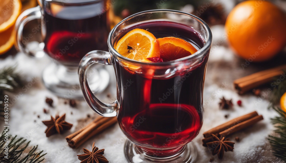 Mulled wine in a glass mug with orange slices and spices in a cozy winter setting Mulled wine in a glass mug with orange slices and spices in a cozy winter setting