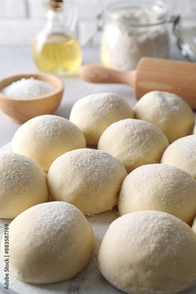 Many raw dough balls on table, closeup Many raw dough balls on table, closeup
