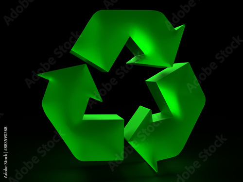 Green recycle symbol glowing on black background representing environmental awareness