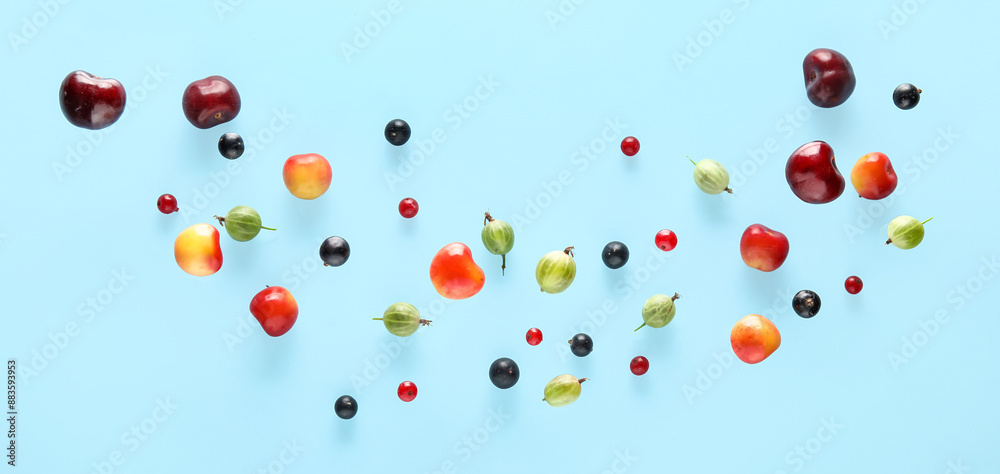 Different flying berries on light blue background Different flying berries on light blue background