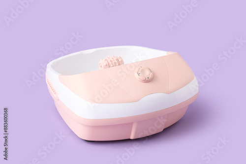 Massage foot bath on purple...
