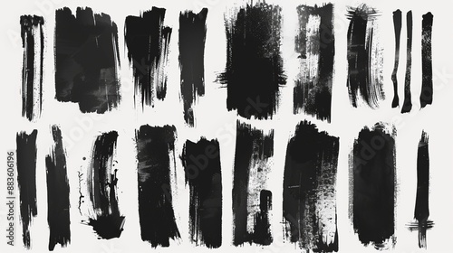 A collection of dynamic black brush strokes, each with its own unique texture, arranged on a white paper background to emphasize their individual artistic characteristics.