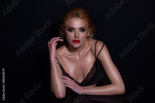 Young woman with perfect skin, natural make-up and a beautiful face. Female portrait with bare shoulders on studio background. Advertising natural cosmetics for beauty salon.