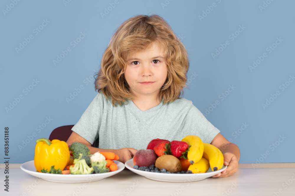 Kid with fruits and vegetables. Healthy food. Children eat breakfast. Kid with fruits and vegetables. Healthy food. Children eat breakfast.