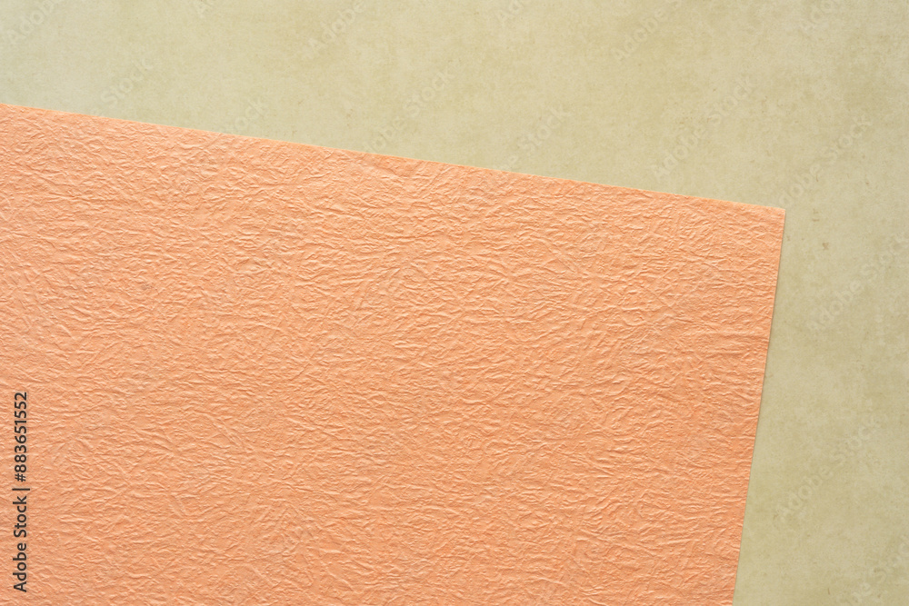 Fototapeta premium pastel orange and tan paper background