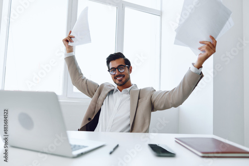 Planning office holding businessman document glasses happy laptop suit technology company winner paper