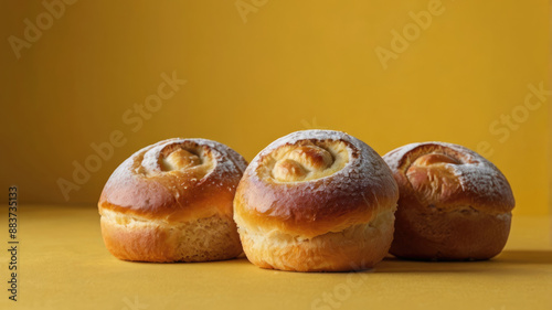 Wallpaper Mural Freshly baked buns on a yellow background, selective focus. Torontodigital.ca