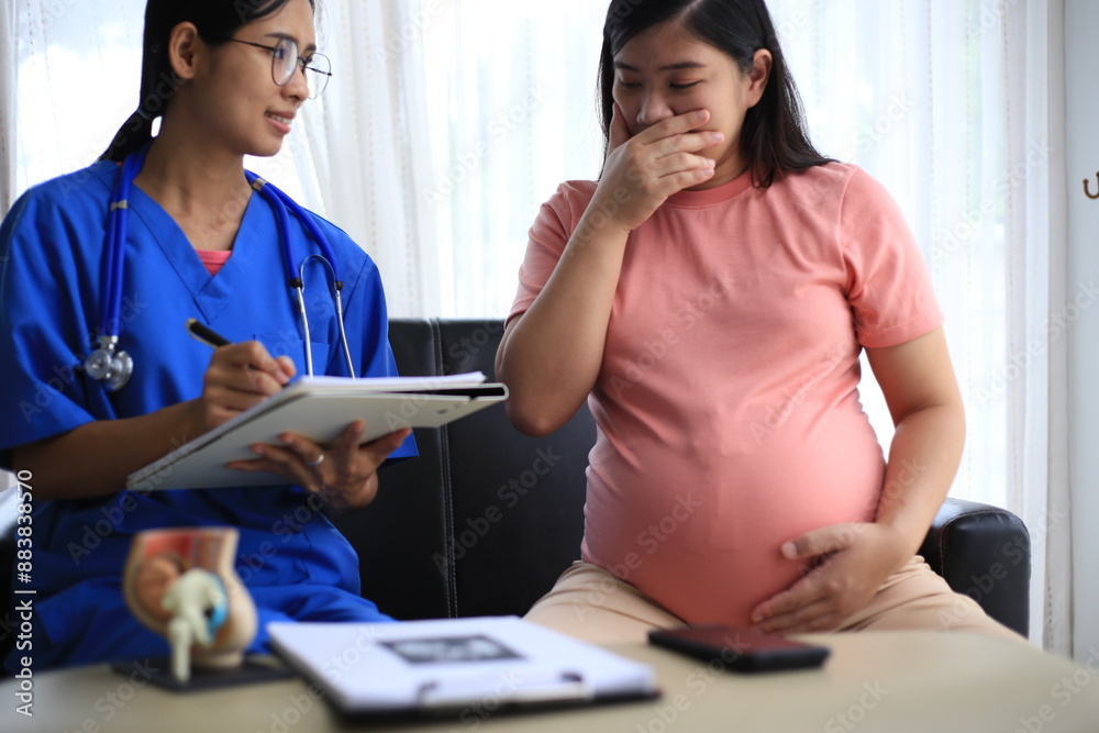 Fototapeta premium Pregnant women in Asia Have your doctor do a pregnancy test. Doctors will perform scans and x-rays to determine if the fetus is a girl or a boy at the hospital. Mom is worried.