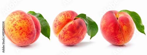  A group of peaches with green leaves against a white backdrop One peach is sliced in half, revealing its pink flesh, while the other remains whole