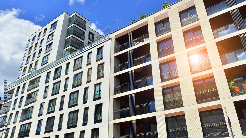 Fototapeta premium European residential architecture. Elements of modern architecture in apartment building. The facade of the building is made modern panels of different shades. 