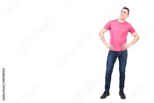 Canvas Print Thoughtful man standing with hands on waist and looking away