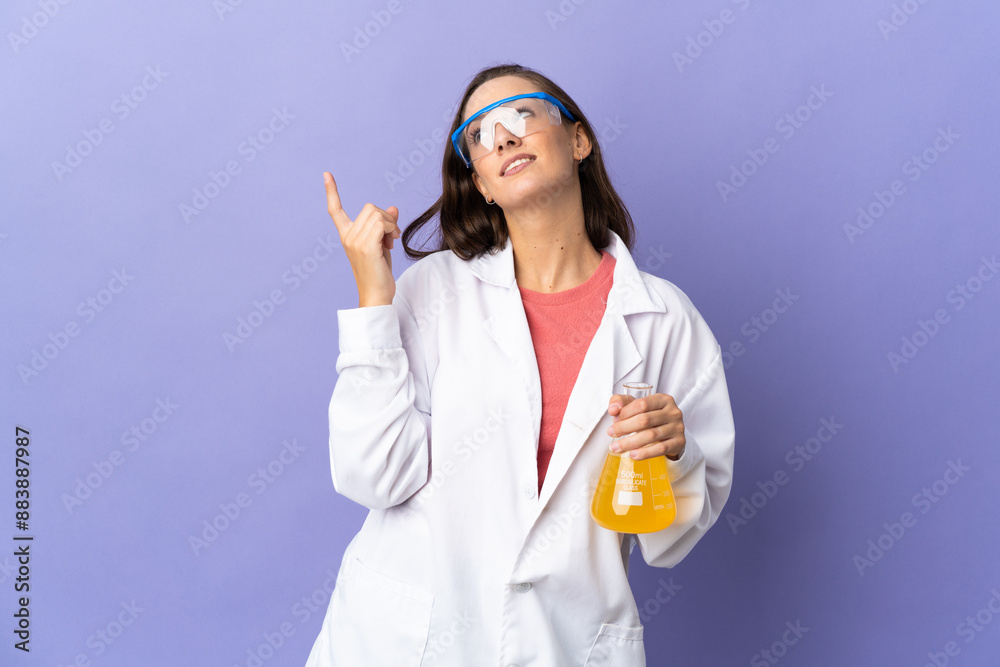 Young scientific woman over isolated background pointing up a great idea Young scientific woman over isolated background pointing up a great idea