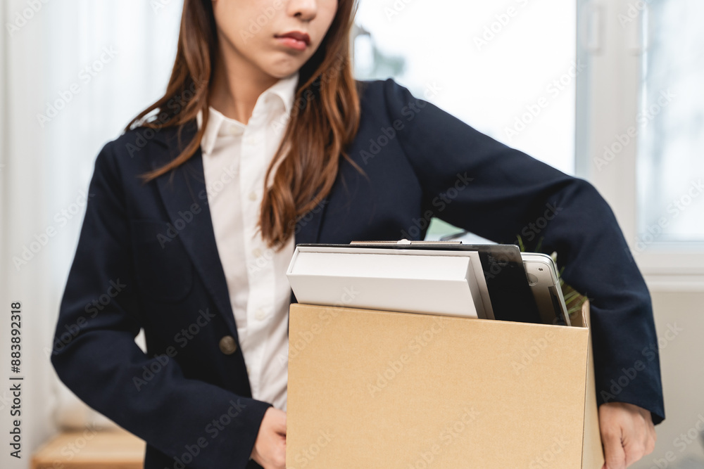 Office worker packing stuff to leave office after resign from job. Office worker packing stuff to leave office after resign from job.