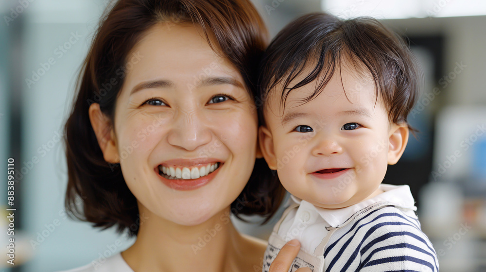 Portrait of happy smiling Asian Korean mother holding her son. Happy motherhood, family concept. Mother's day. Portrait of happy smiling Asian Korean mother holding her son. Happy motherhood, family concept. Mother's day.