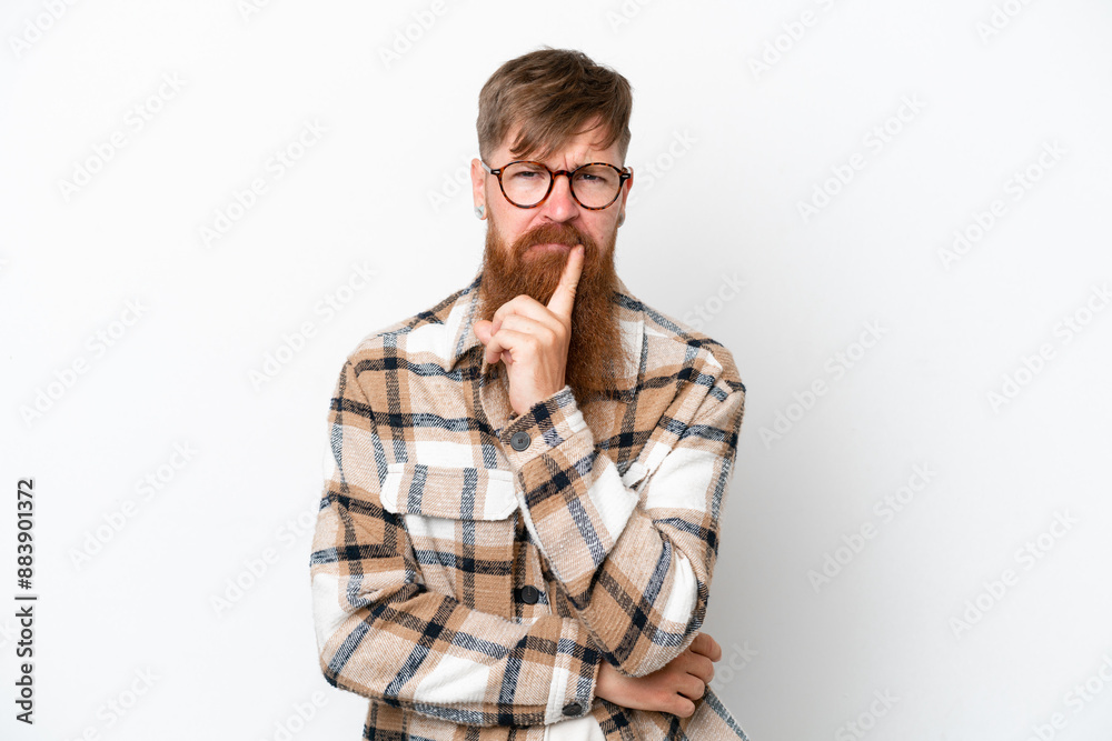 Redhead man with long beard isolated on white background and thinking Redhead man with long beard isolated on white background and thinking