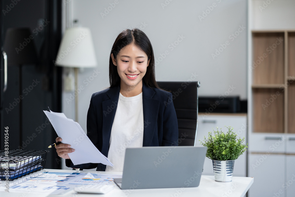 Business concepts, business woman working in the work area with smartphones and laptop, data sheets at the desk. Business concepts, business woman working in the work area with smartphones and laptop, data sheets at the desk.