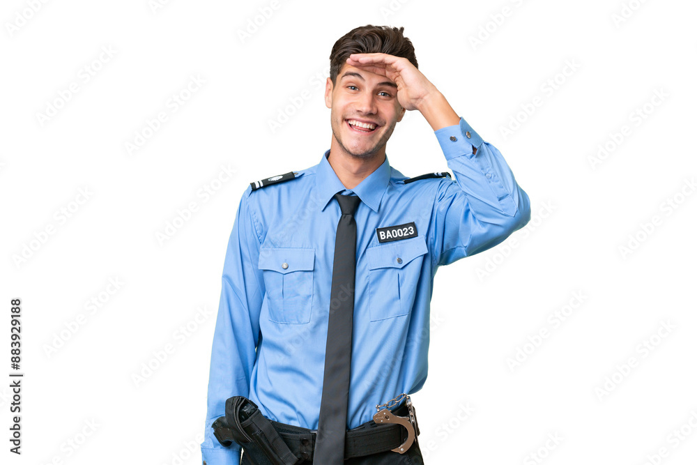 Young police man over isolated background looking far away with hand to look something Young police man over isolated background looking far away with hand to look something