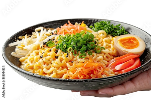 Ramen with accompaniments in a black plate, with a hand holding chopsticks, looks delicious on a clean white background, typical Japanese food