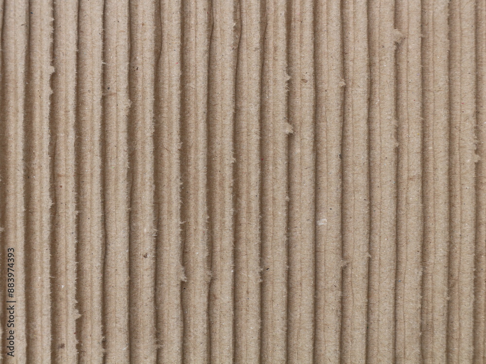 Close up, the middle layer of used cardboard with a wavy texture. Abstract background Close up, the middle layer of used cardboard with a wavy texture. Abstract background