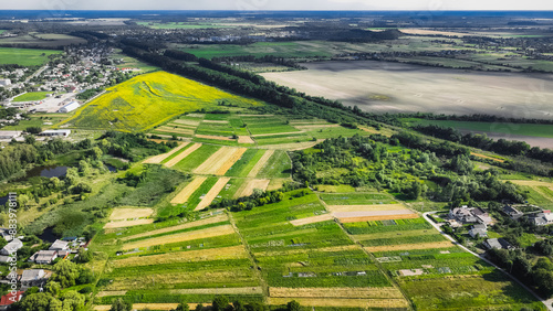 outskirts village country side aerial top view Ukraine field agriculture space landscape end of summer harvest season