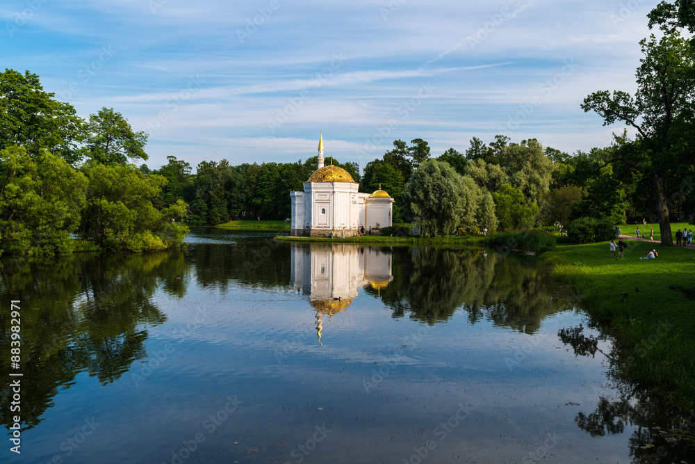 Evening panorama on the large pond of Catherine Park with the Turkish bath. Tsarskoe Selo, Pushkin, St. Petersburg, Russia. Evening panorama on the large pond of Catherine Park with the Turkish bath. Tsarskoe Selo, Pushkin, St. Petersburg, Russia.