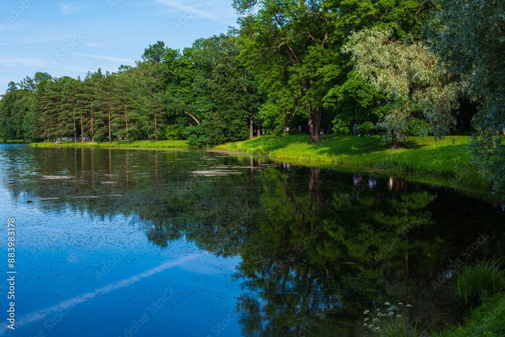 Picturesque evening landscape with reflection in the water in Catherine Park. Tsarskoe Selo, Pushkin, St. Petersburg, Russia. Picturesque evening landscape with reflection in the water in Catherine Park. Tsarskoe Selo, Pushkin, St. Petersburg, Russia.