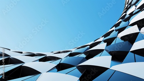 Unique, curved building with blue glass windows under clear sky
