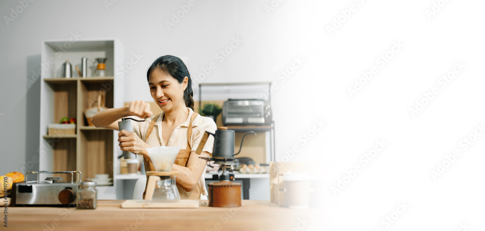 Asian barista brewing fresh espresso. Enjoy a cozy, trendy cafe experience with high quality beans in home or cafe Asian barista brewing fresh espresso. Enjoy a cozy, trendy cafe experience with high quality beans in home or cafe