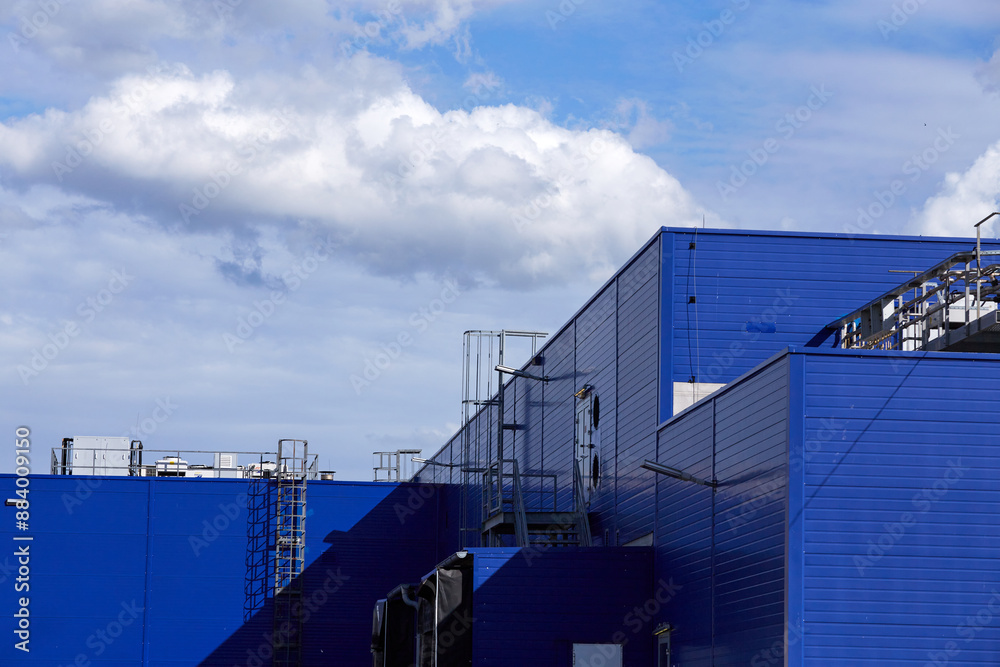 blue Building Wall of Industrial Factory against blue