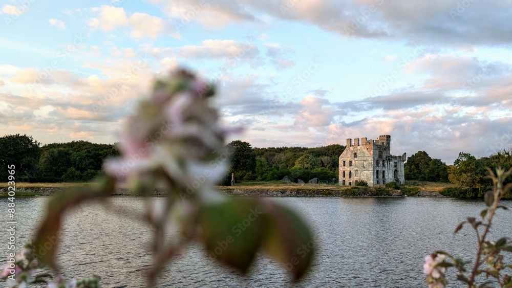 Beautiful scenery of Menlo Castle 16th century ruin by the River Corrib at sunset in Galway, Ireland, historic architecture