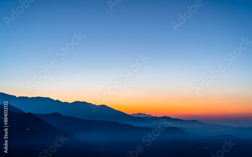 Landscape view of gloomy sunrise over the mountian range in Nepal. photo