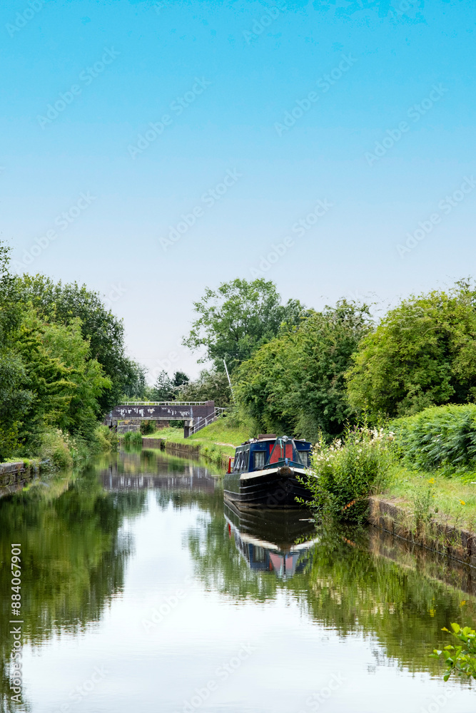 Narrow boat on Trent and Mersey canal in Cheshire UK Narrow boat on Trent and Mersey canal in Cheshire UK