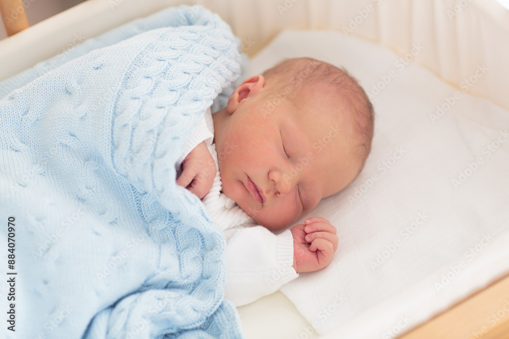 Newborn baby boy in hospital cot Newborn baby boy in hospital cot