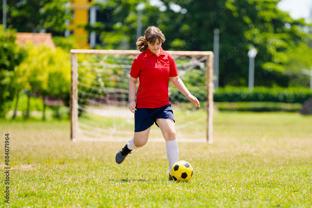Child playing football. Kids play soccer. Child playing football. Kids play soccer.