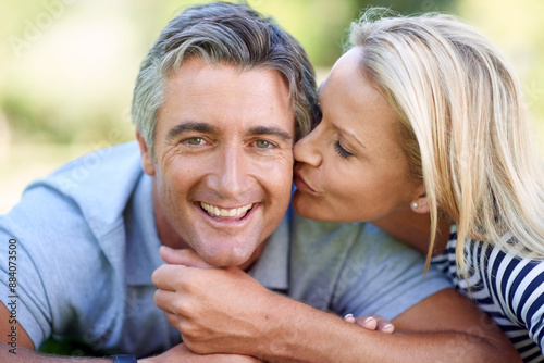 Mature couple, kiss and outdoor portrait of love, relationship and relax in garden for bonding. People, park date and affection for husband in nature, support and countryside marriage for romance