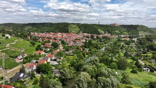 Flight towards Freyburg along the river Unstrut. Old town and vineyards in the background. Neuenburg Castle on the mountain plateau. Travel Destination in Saxony-Anhalt. Famous for wine growing.