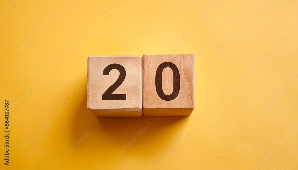 Wooden cubes with number 20 on isolated yellow backdrop. Wood blocks. Close-up. Flat lay Wooden cubes with number 20 on isolated yellow backdrop. Wood blocks. Close-up. Flat lay