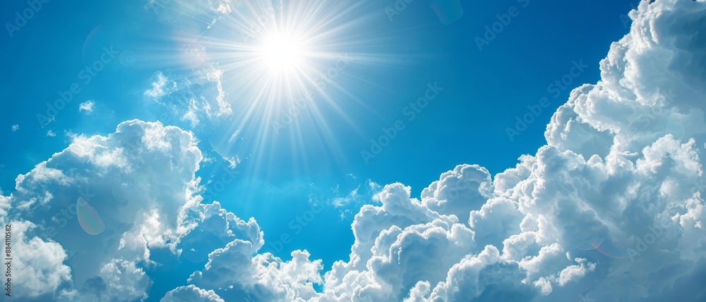 A bright blue sky dotted with clouds; sun glints above, beaming down A bright blue sky dotted with clouds; sun glints above, beaming down