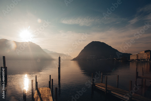 Canvastavla Autumnal dramatic sunrise from the Lugano lakefront with San Salvatore peak and Italian mountains in the background, Switzerland